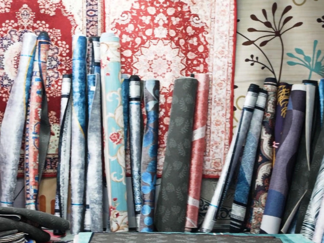 Assorted Patterned Carpets and Rolled Flooring Samples