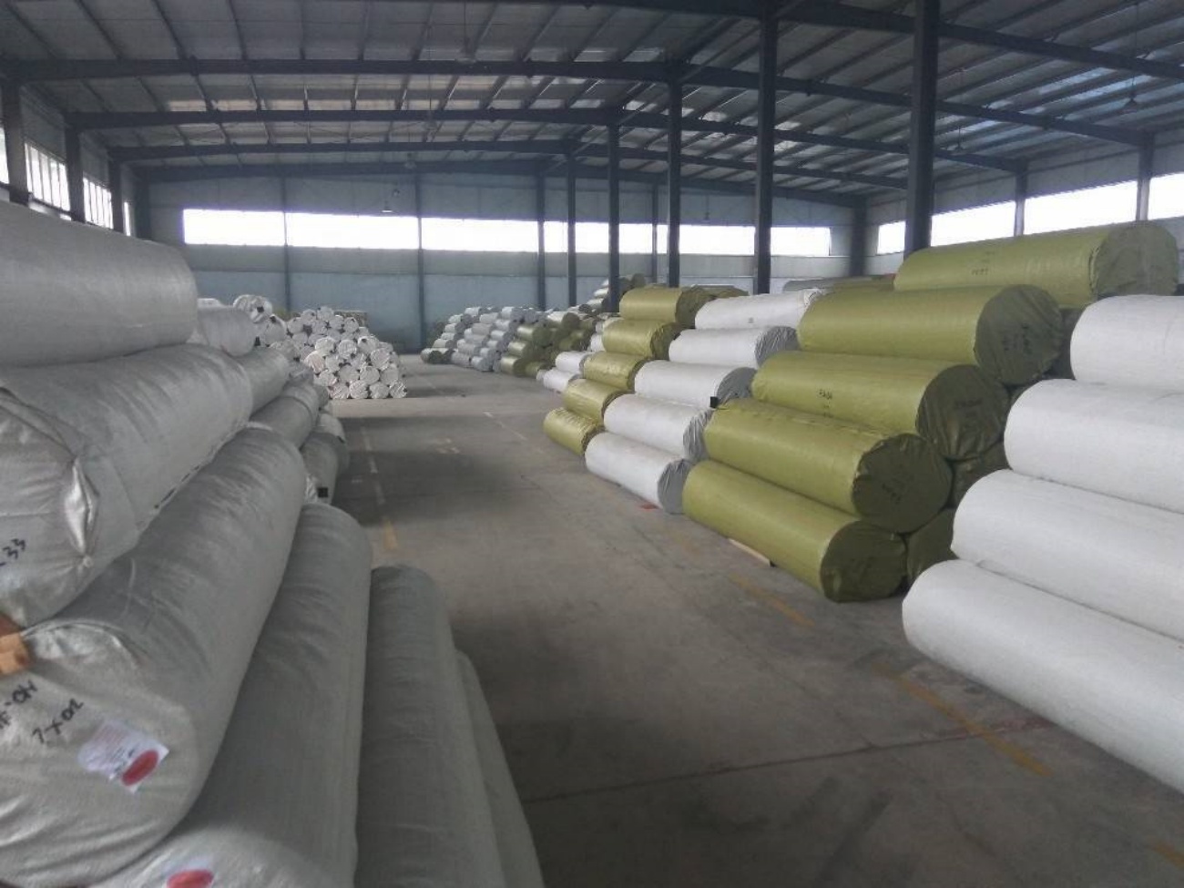 Wrapped Carpet Rolls Stored in Bulk Warehouse